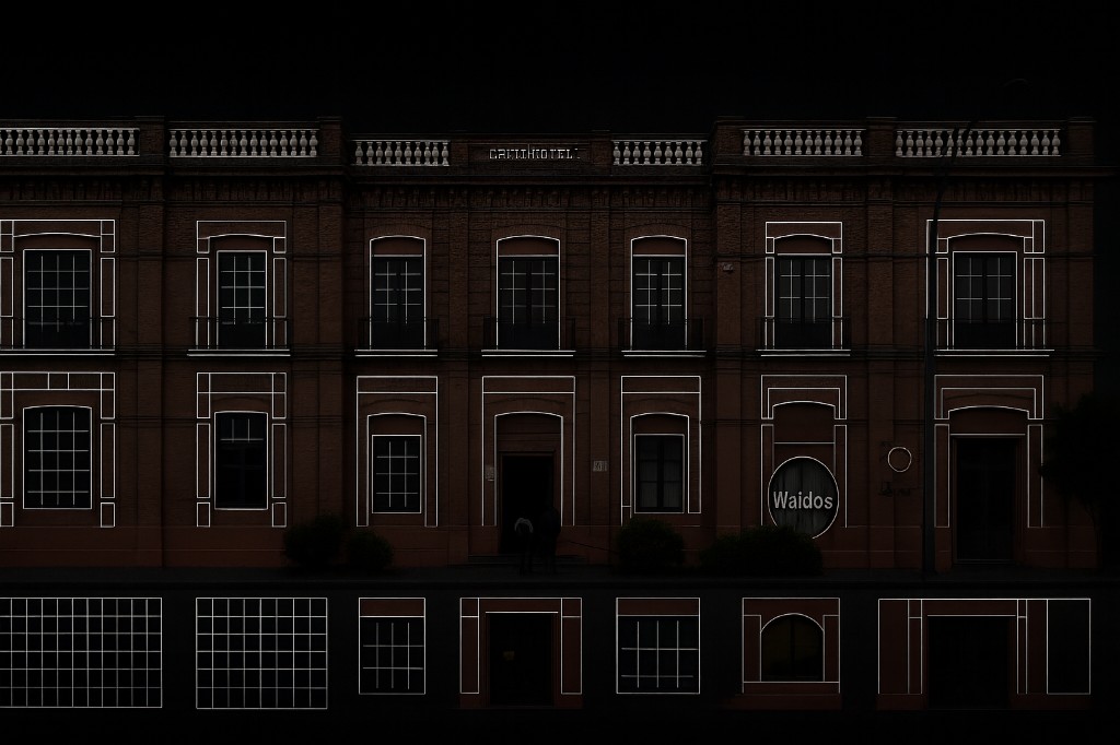 On-site projector calibration — wireframe outline aligned to the historic building at night